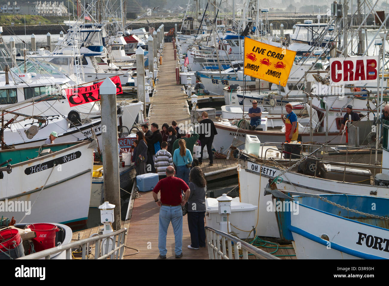 Crab fishermen selling fresh crabs from their boats on the dock at