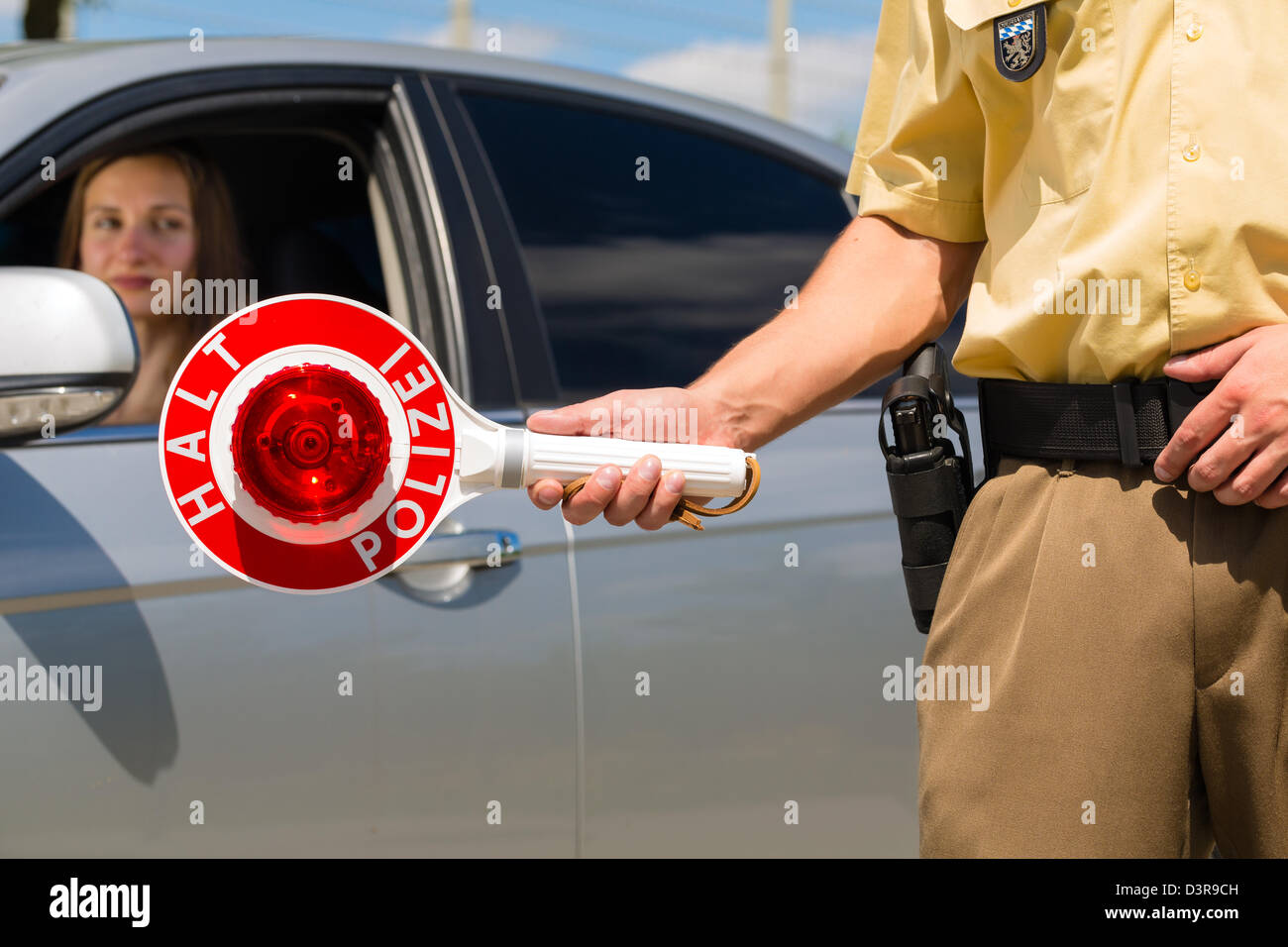 Police - policeman or cop in uniform stop car in traffic control Stock Photo