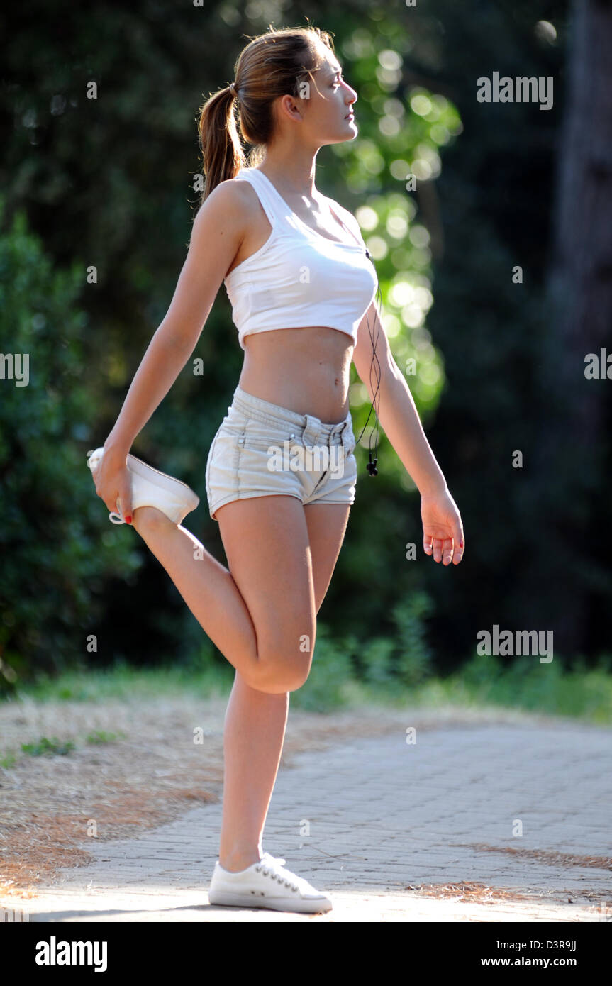Woman doing stretching exercises Stock Photo