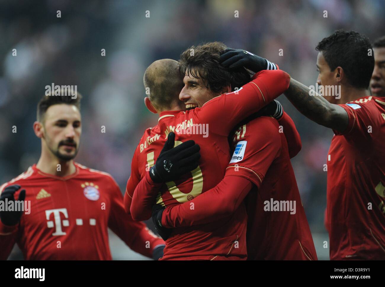 Munich, Germany. 23rd February 2013. Munich's Javier Martinez (3-L) celebrates his 2-0 goal with teammates Diego Contento (L), Arjen Robben and Luiz Gustavo (R) during the Bundesliga soccer match between FC Bayern Munich and SV Werder Bremen at Allianz Arena in Munich, Germany, 23 February 2013. Photo: ANDREAS GEBERT /dpa/Alamy Live News  (ATTENTION: EMBARGO CONDITIONS! The DFL permits the further  utilisation of up to 15 pictures only (no sequntial pictures or video-similar series of pictures allowed) via the internet and online media during the match (including halftime), taken from inside t Stock Photo