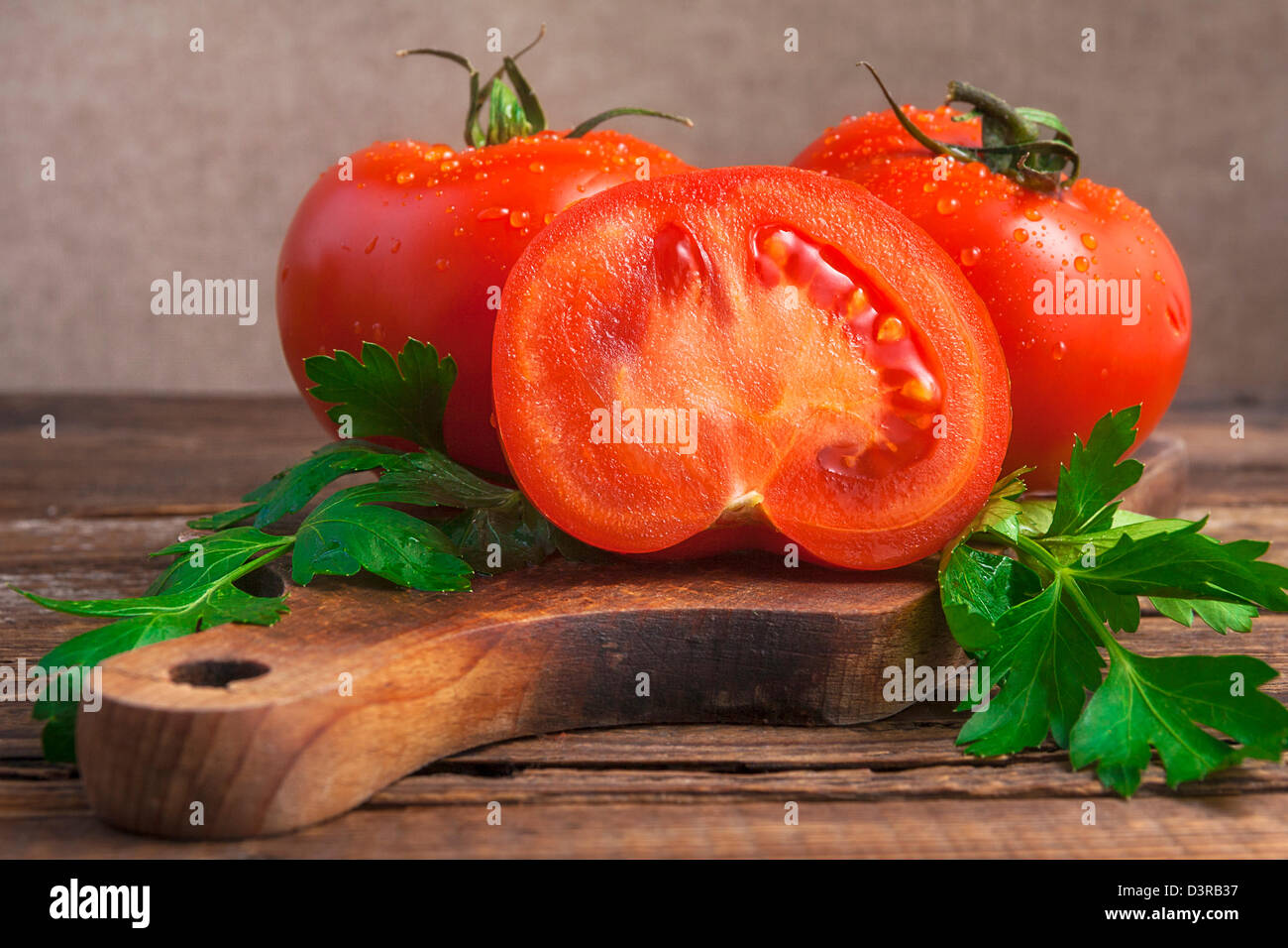 Art vintage composition with tomatos on wooden board Stock Photo