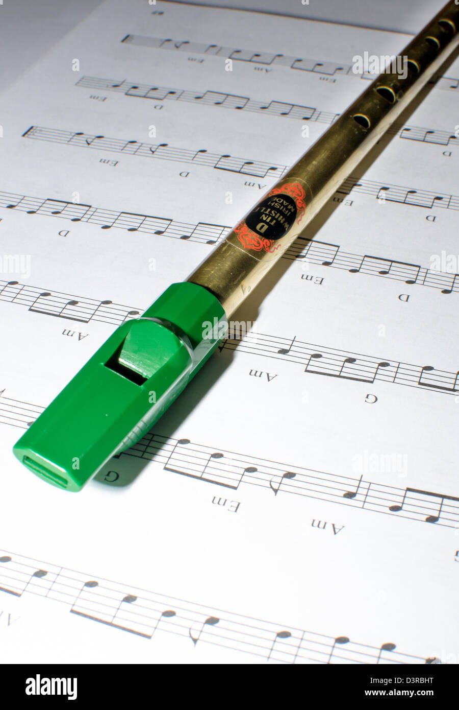 Traditional Penny Tin Whistle And Note Sheet Stock Photo
