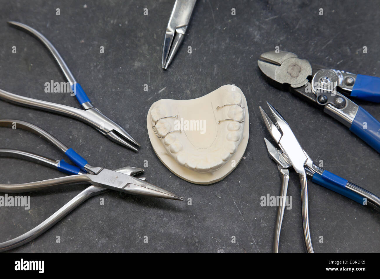 Berlin, Germany, pliers for bending wire for the manufacture of dental  braces Stock Photo - Alamy