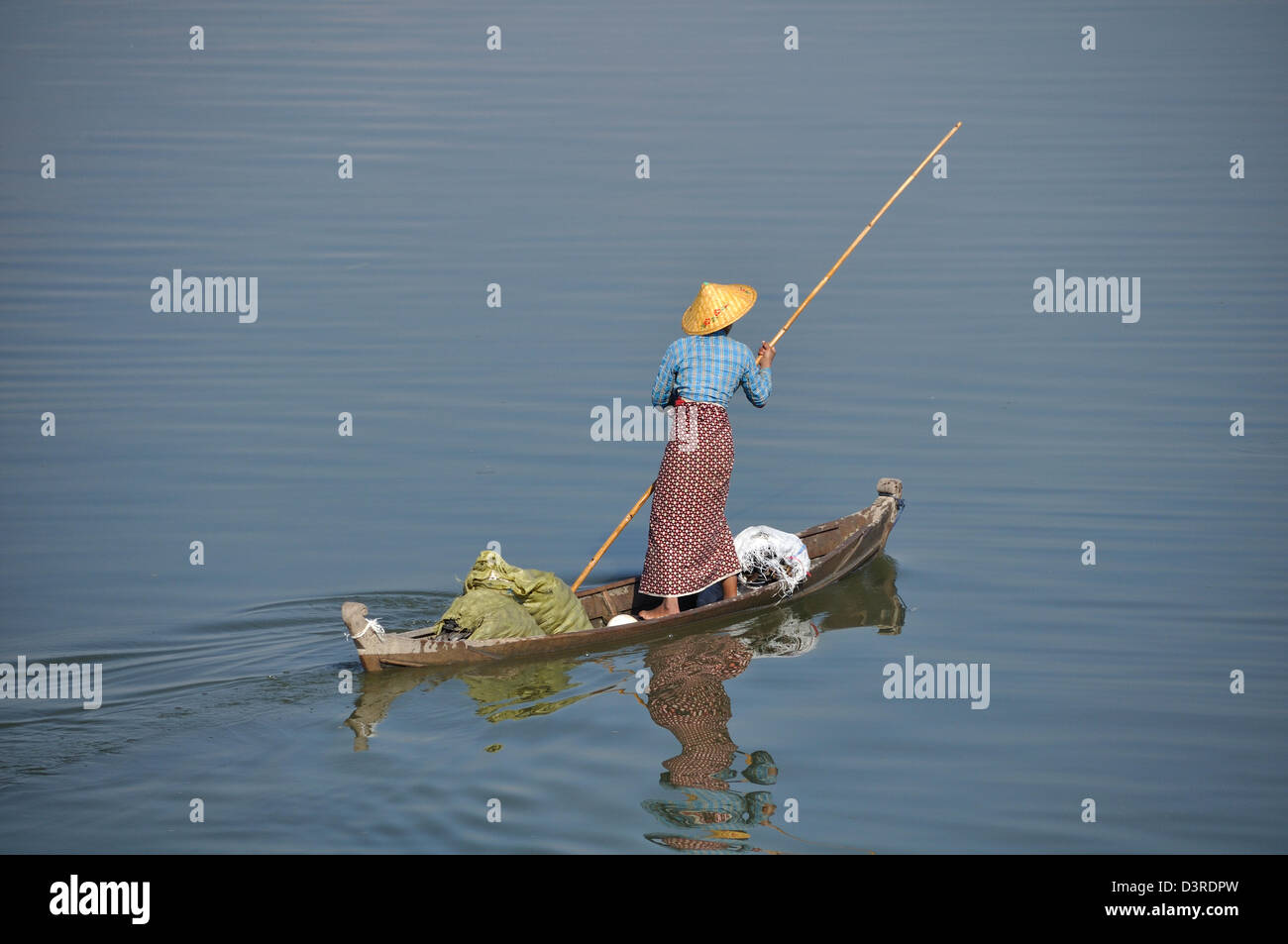 A Local Woman Punts a Boat Across Taungthaman Lake, Yangon(Rangoon) Myanmar(Burma) Stock Photo