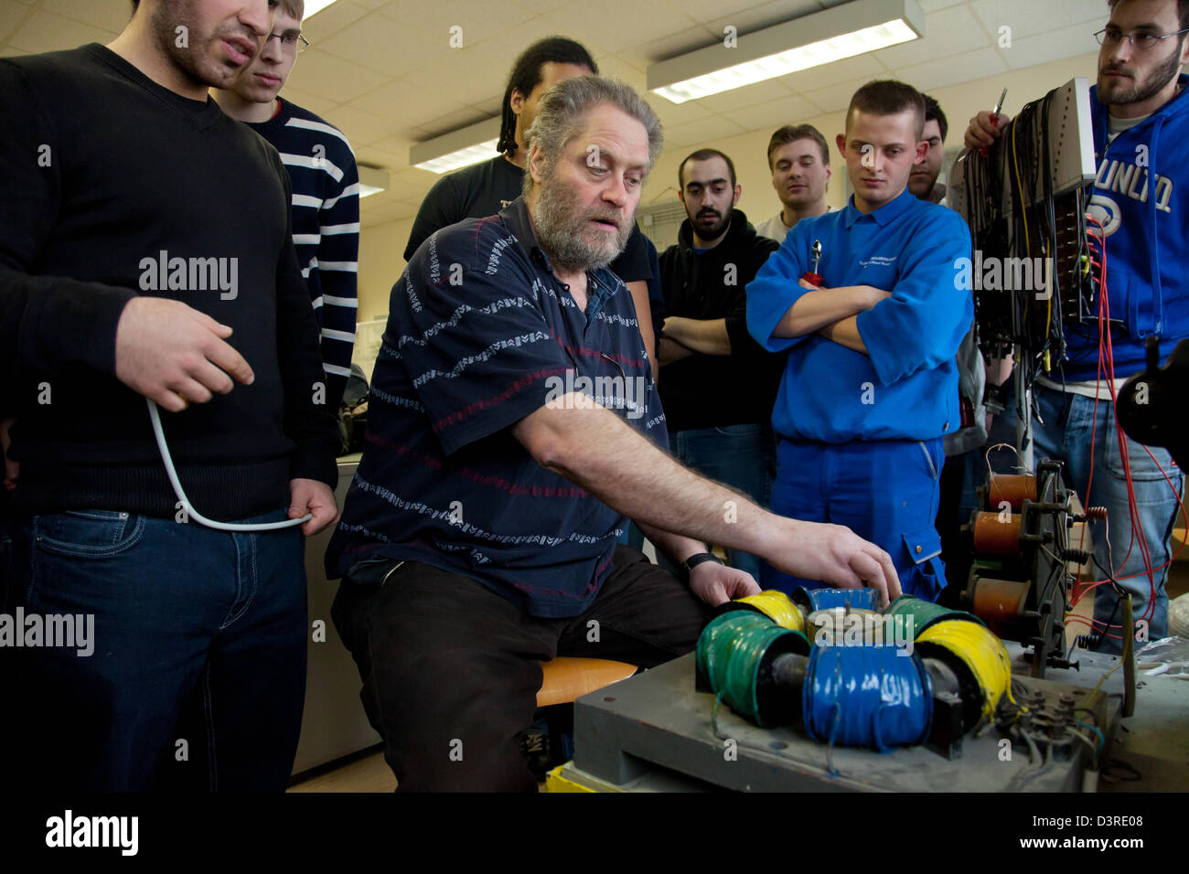 Berlin, Germany, a teacher explains the apprentices how an electric