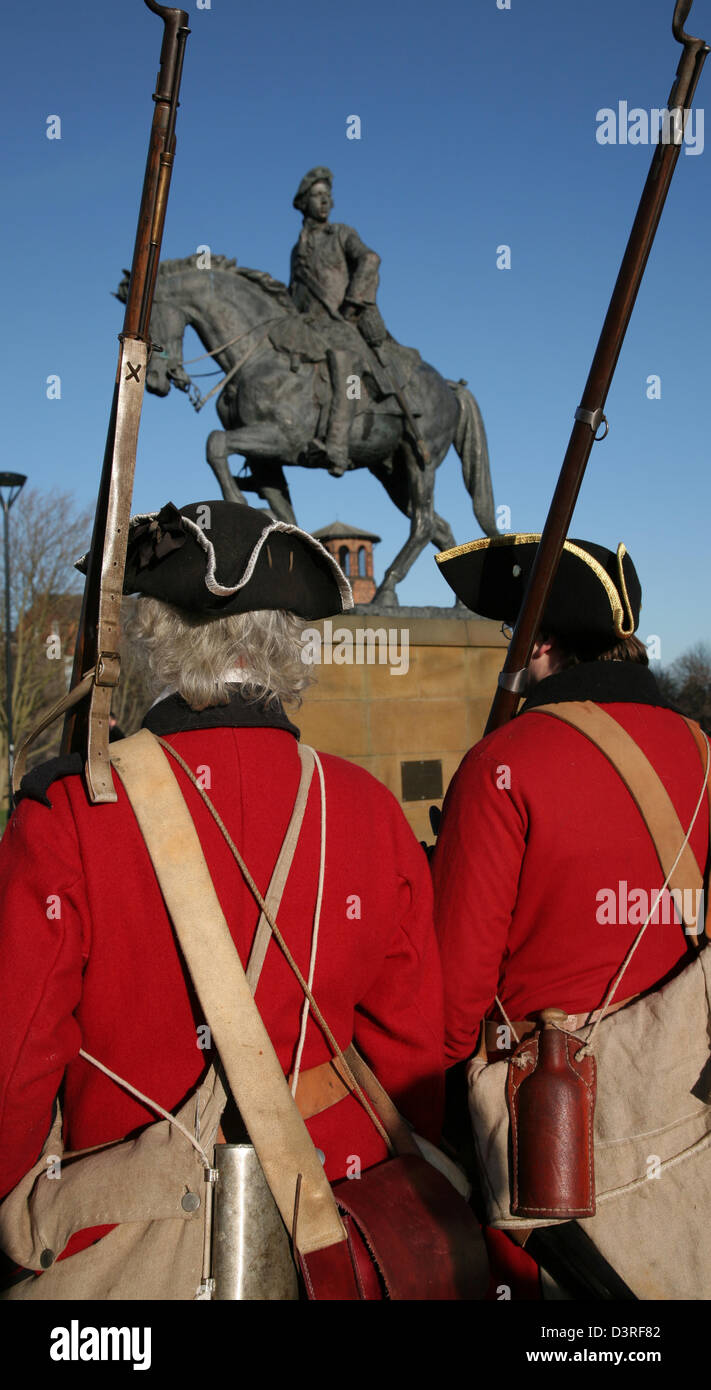 Members of the Charles Edward Stewart Society beside a statue of Bonnie Prince Charlie, Derby, Derbyshire Stock Photo