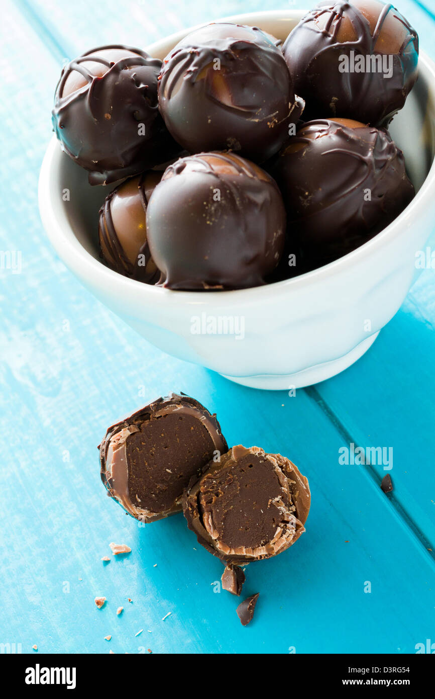 Gourmet dark milk chocolate truffles hand made by chocolatier. Stock Photo