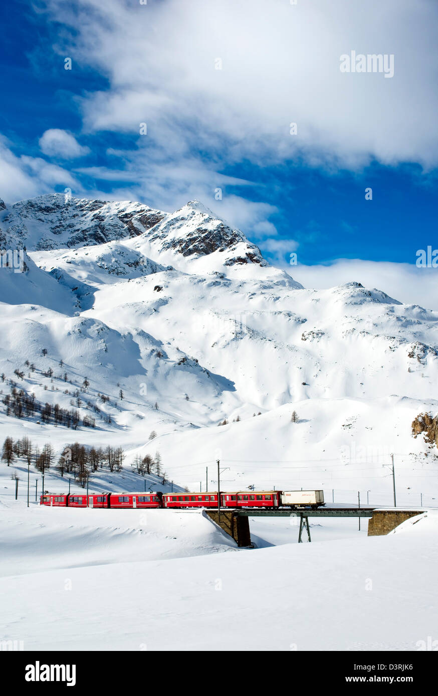 Mountain train at Lago Bianco Bernina Pass in Winter, Grisons, Switzerland Stock Photo