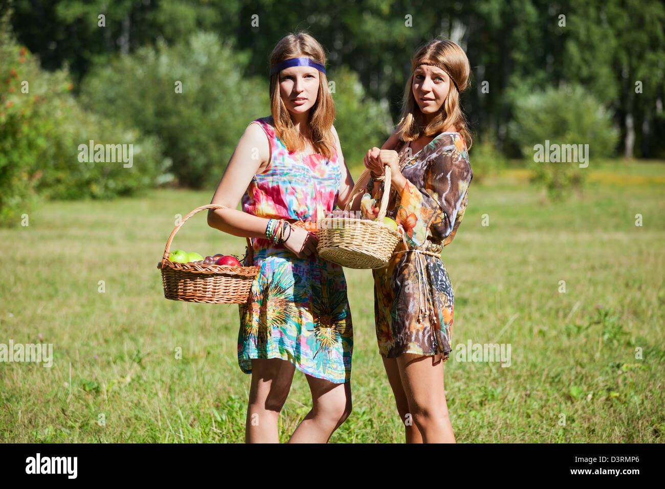 Young girls with a fruit basket Stock Photo - Alamy