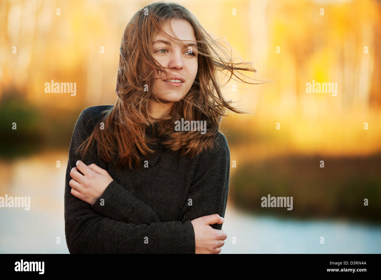 Young girl in an autumn park Stock Photo - Alamy