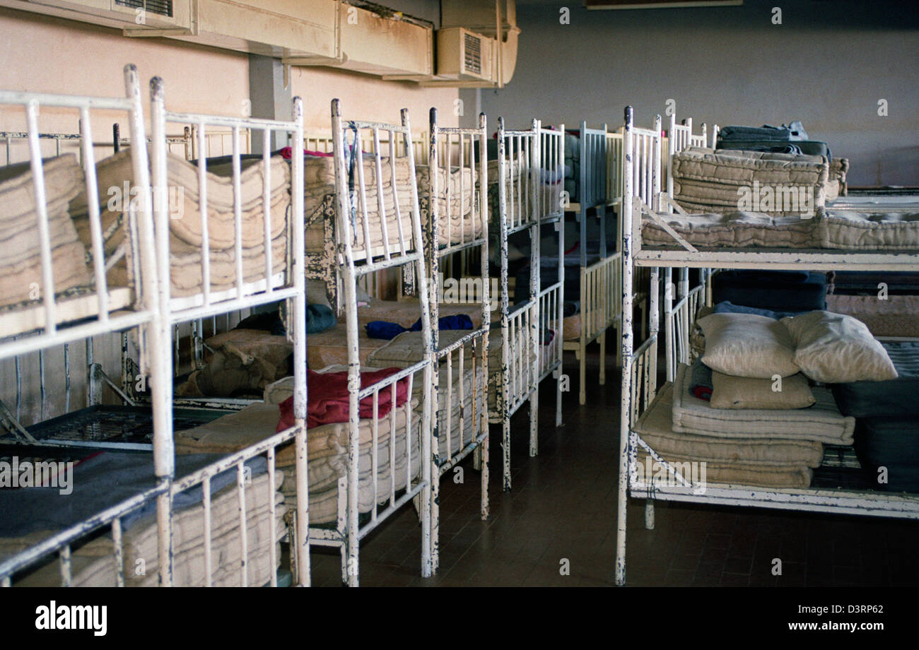 Empty beds in the detention camp Omarska, Bosnia and Herzegovina Stock Photo