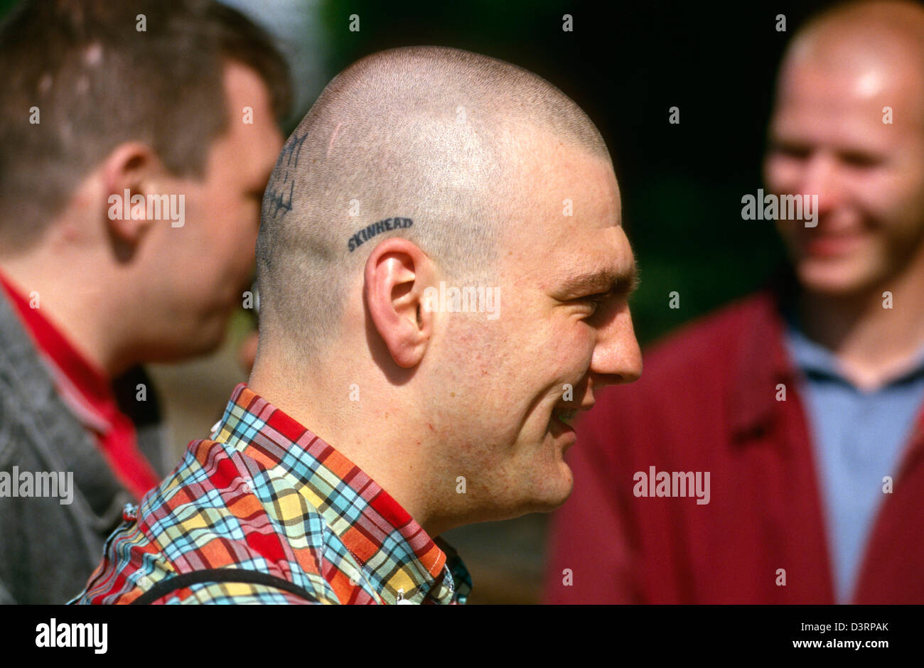 Oi!-The Meeting, a young man with the word SKINHEAD tattooed on his head, Luebeck, Germany Stock Photo