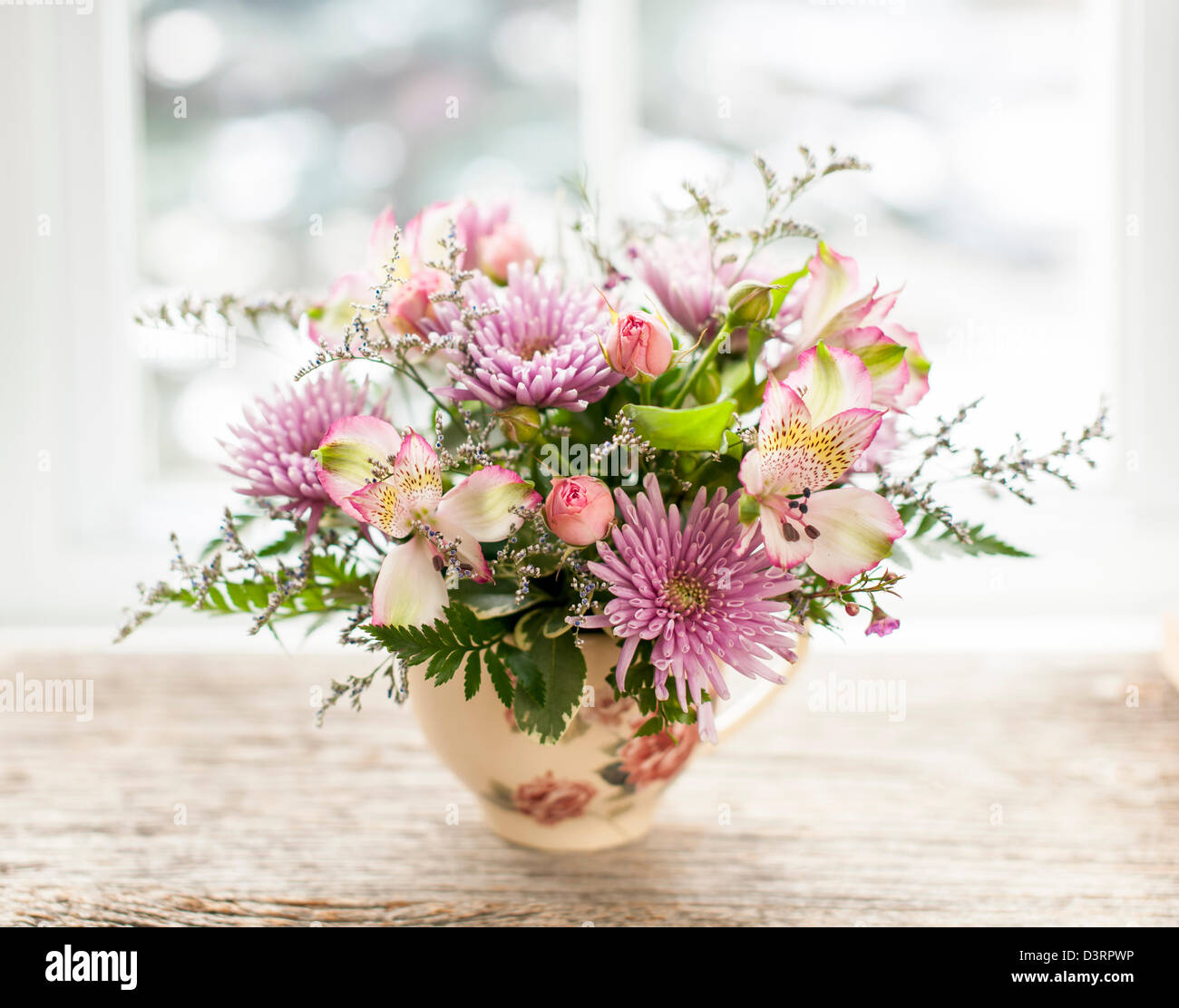 Bouquet of colorful flowers arranged in small vase Stock Photo Alamy