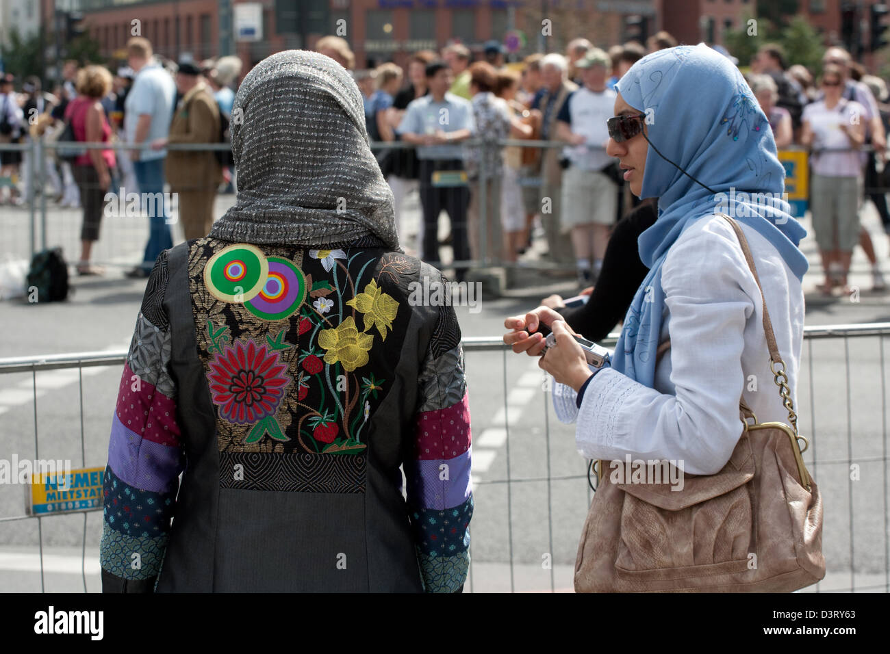 Berlin, Germany, young women wearing headscarves waiting Marathonlaeufer Stock Photo