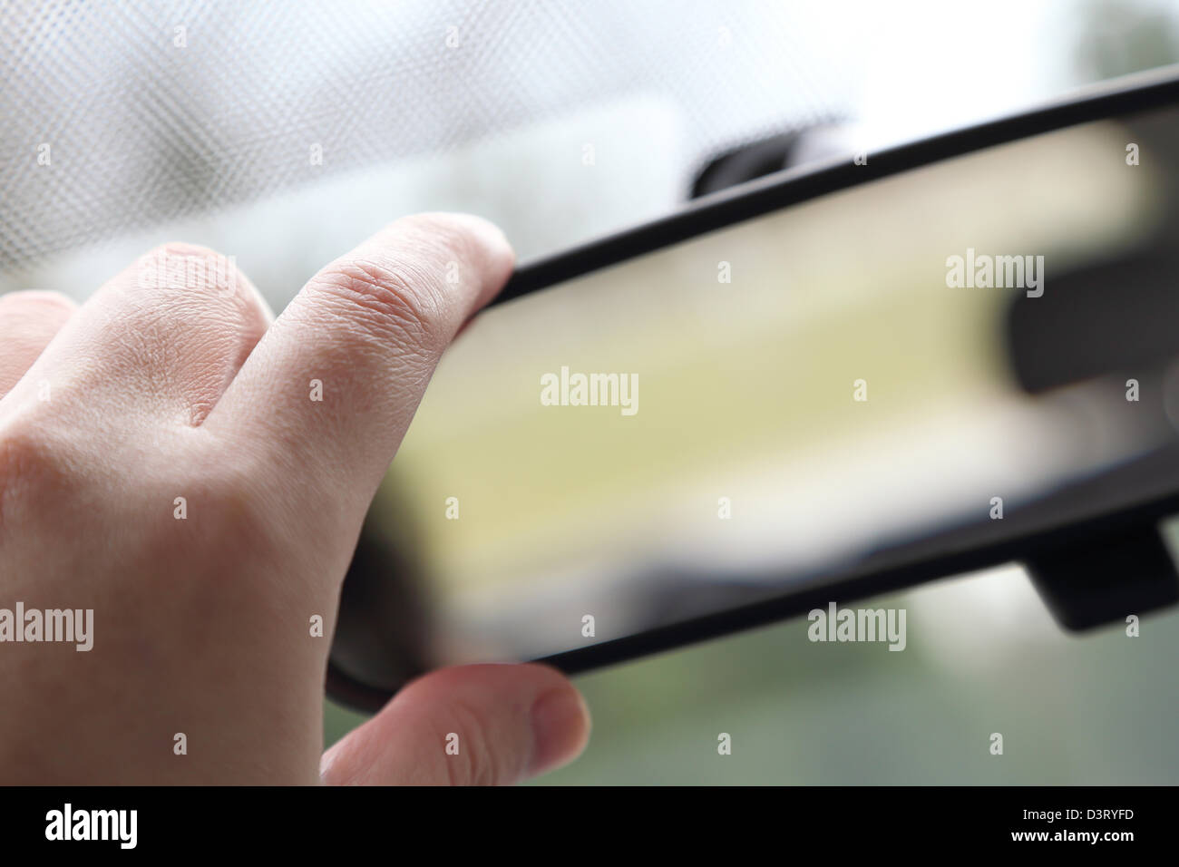 Adjusting rear view mirror Stock Photo Alamy