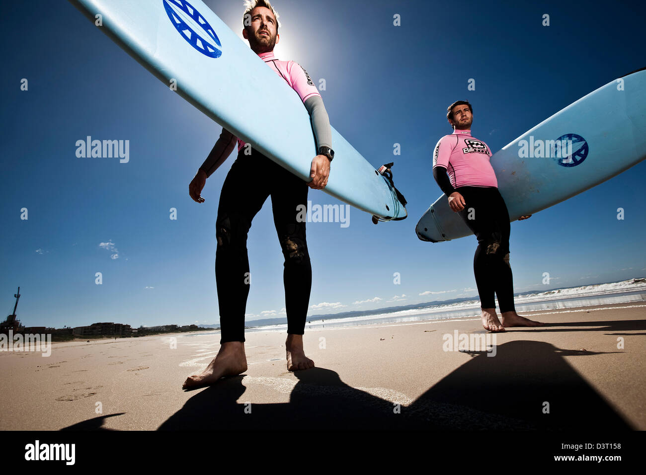 Surfers standing with boards, Jeffreys Bay, Indian Ocean, South Africa Stock Photo
