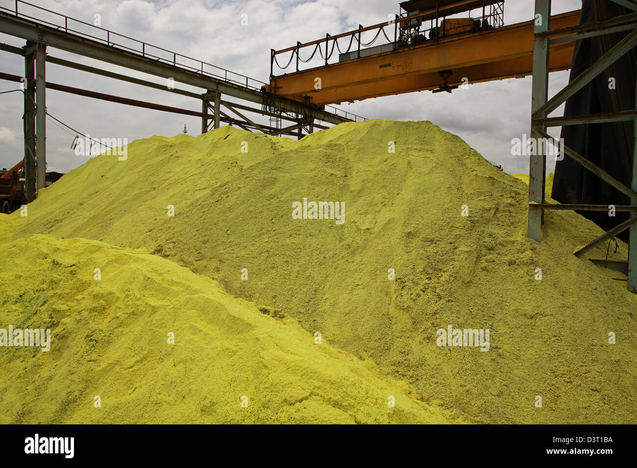 Sulfur stockpile used in extraction process Stock Photo