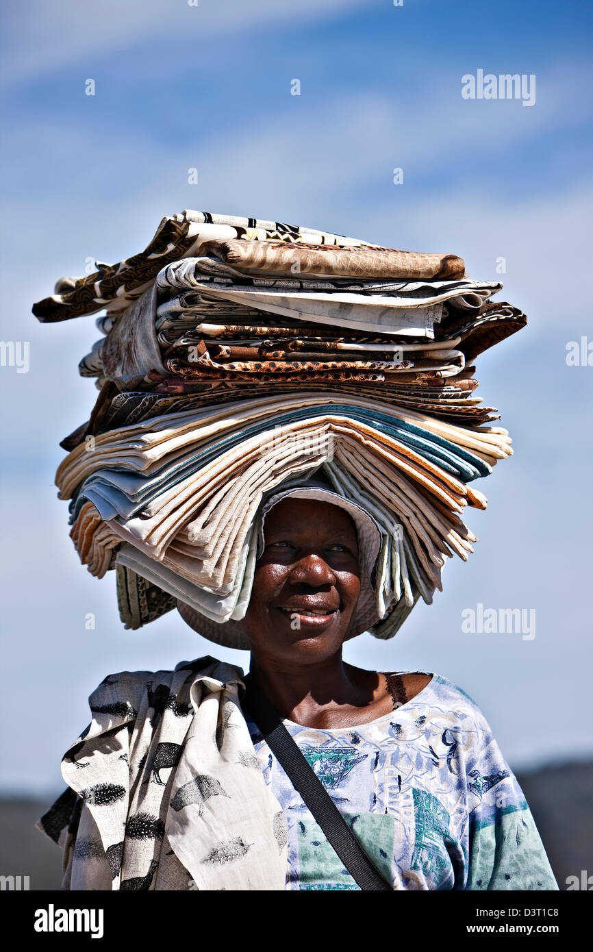 Local woman carrying linen on her head, South Africa Stock Photo Alamy