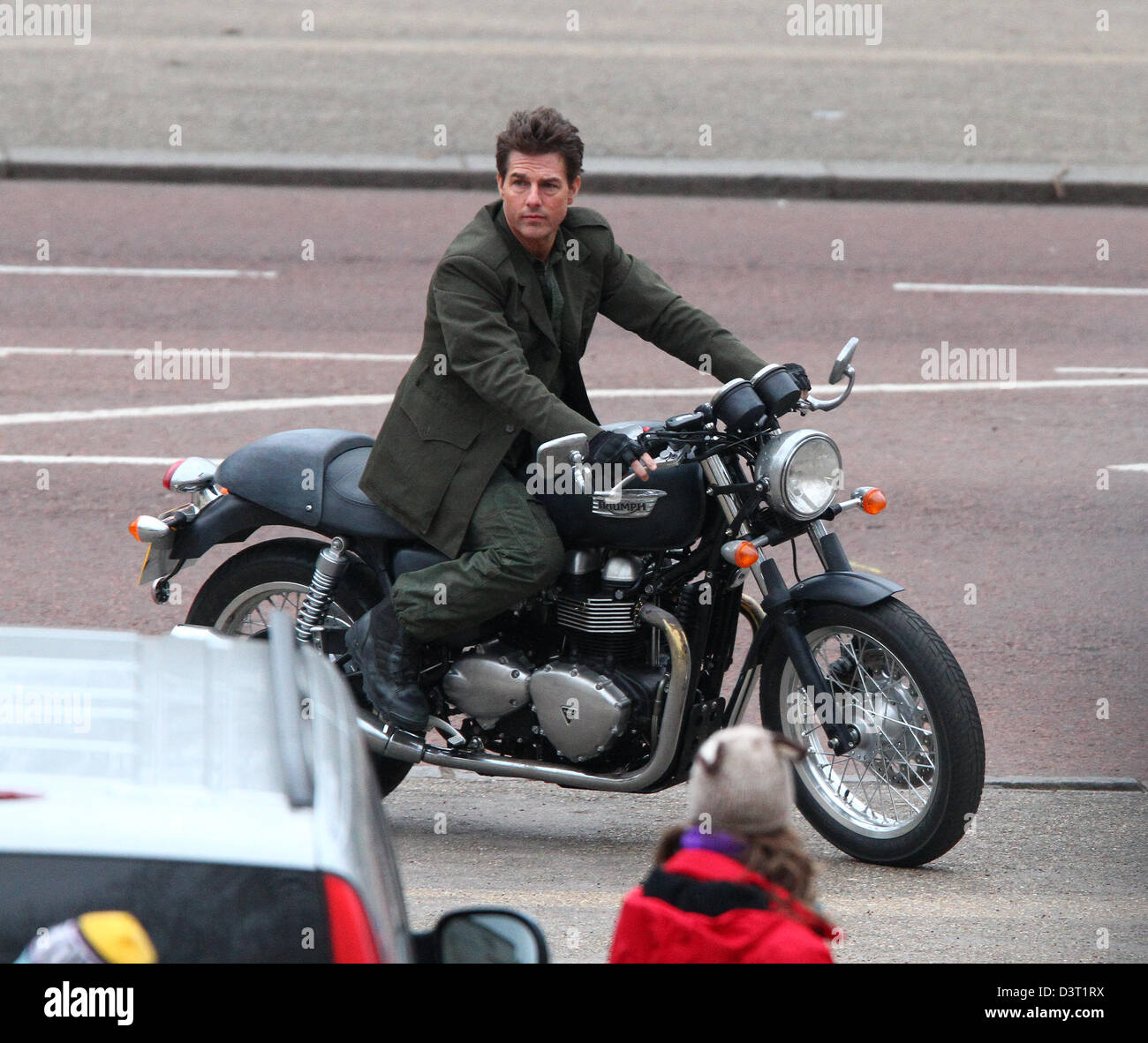 London, UK, 24th February 2013: Tom Cruise seen riding on a Triumph  motorcycle while filming scenes from his latest movie "All Y Stock Photo -  Alamy