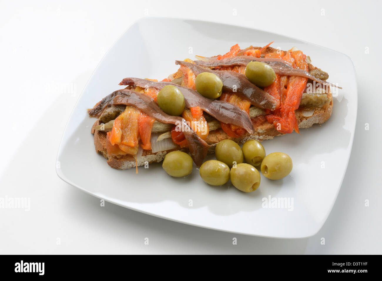 escalivada and olives and anchovies on toast Stock Photo
