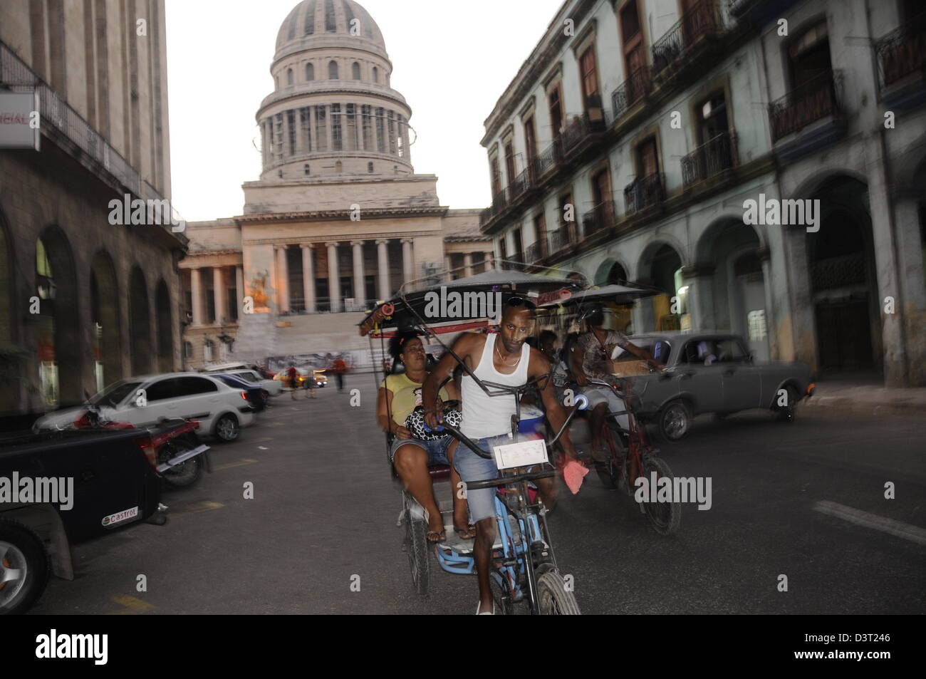 Moving 'Bici' bicycle, calle Brazil with Capitolio in background, Old town Havana Stock Photo