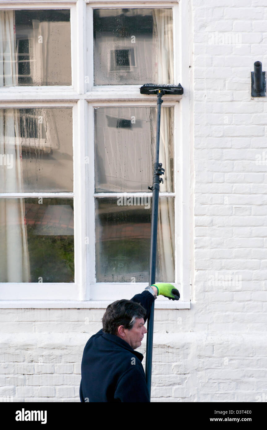 Premium Photo  Man washing and cleaning window at home housework