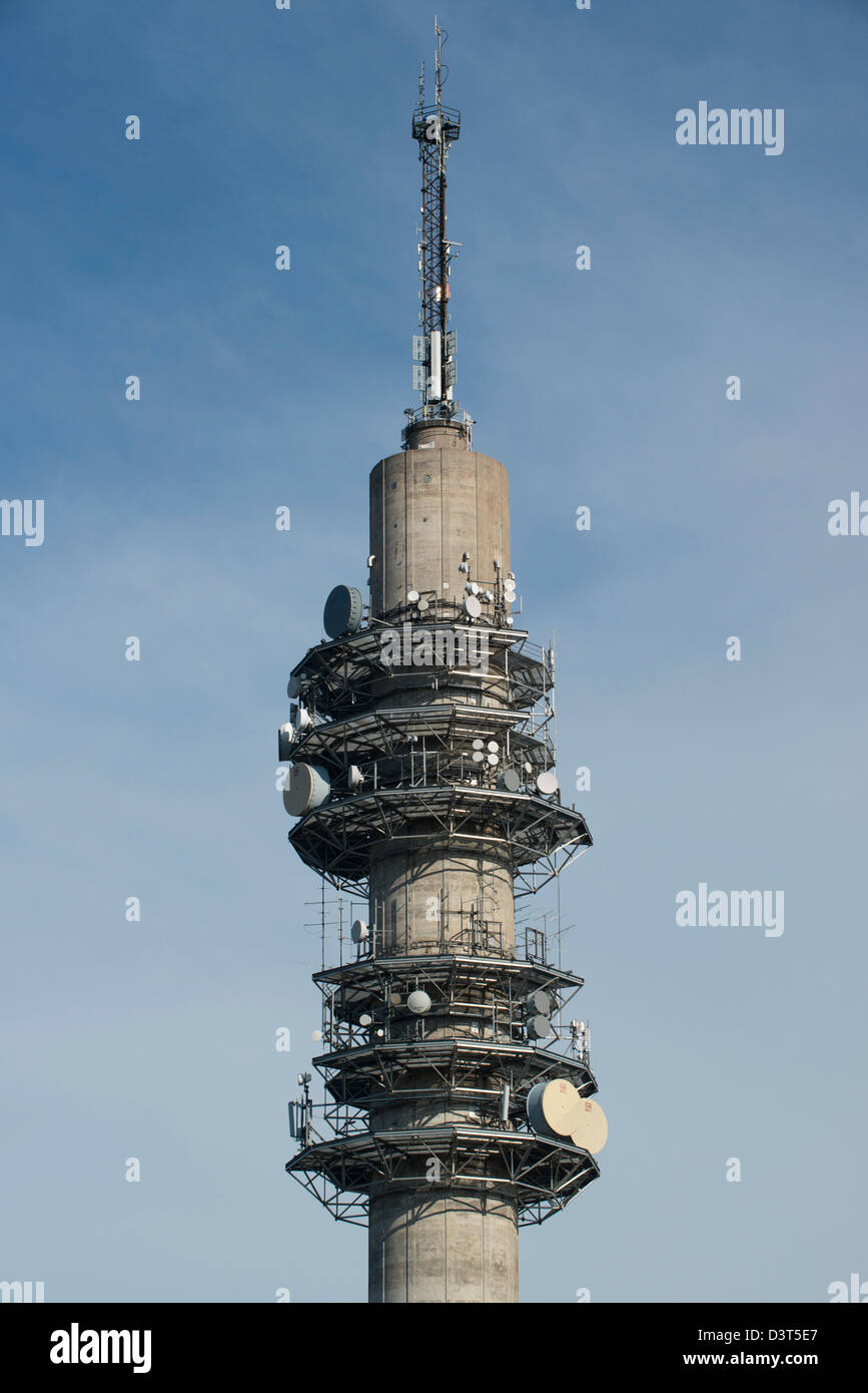 Tower with multiple satellites and devices to send and receive signals Stock Photo