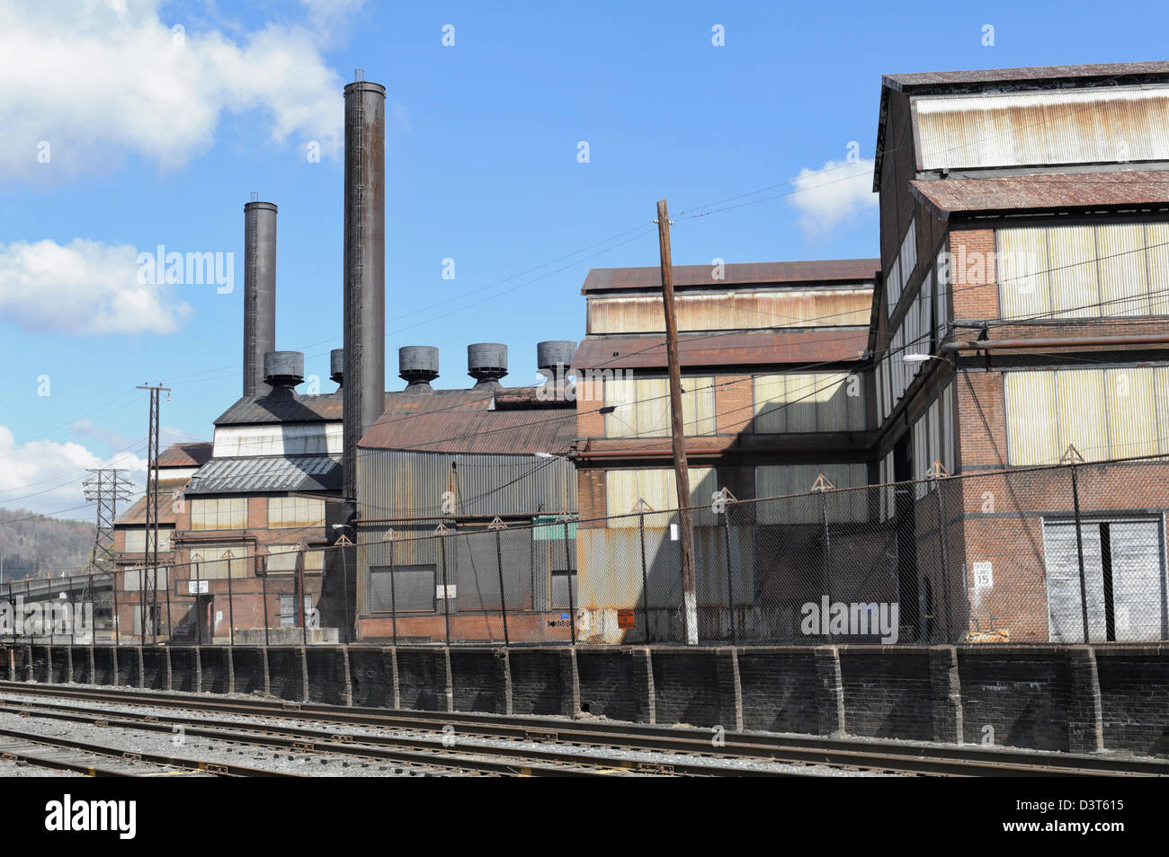 Steel mill buildings and railroad tracks close up, large metal buildings and smokestacks, the industrial rust belt in Johnstown, Stock Photo