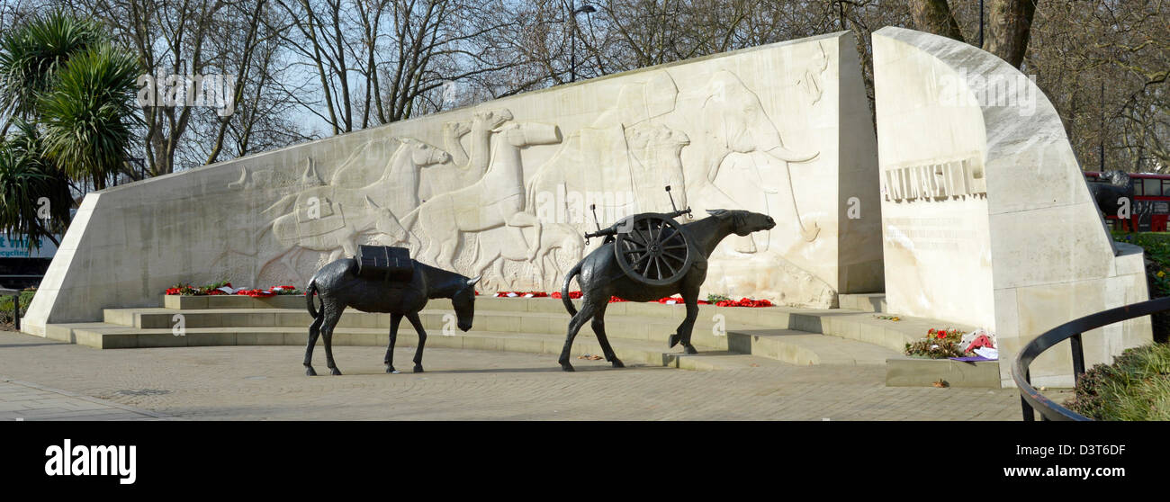 Animals in War memorial bronze mules & curved Portland stone wall sculpture by English sculptor David Backhouse Park Lane Hyde Park London England UK Stock Photo