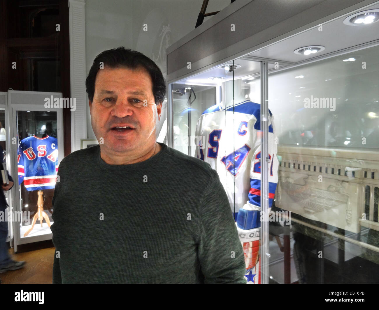 Former US Ice hockey player Mike Eruzione poses in front of his jersey (R) which was auctioned in New York, United States, 23 February 2013. Mike Eruzione wore the shirt during the 1980 Winter Olympics when he was captain of the US ice hockey national team. The United States team, made up of amateur and collegiate players, defeated the Soviet team, who had won nearly every world championship and Olympic tournament since 1954. The 'Miracle on Ice' is one of the Top Sports Moment of the 20th Century. The jersey was sold for 657,250 dollars (498,000 euros). Photo: Nezih Payzin Stock Photo