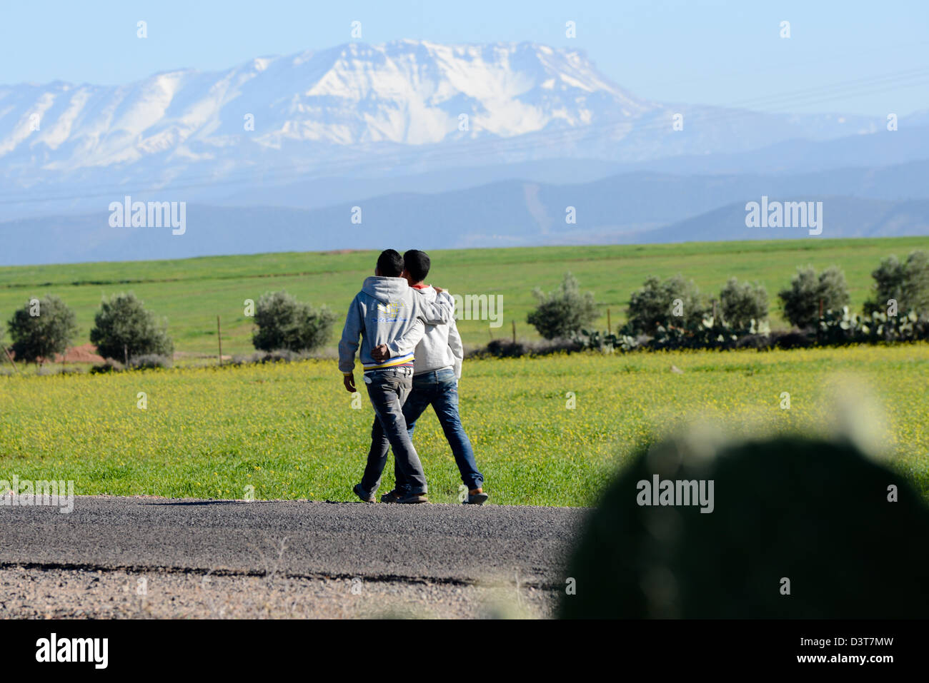 Two boys arms around each other hi-res stock photography and images - Alamy