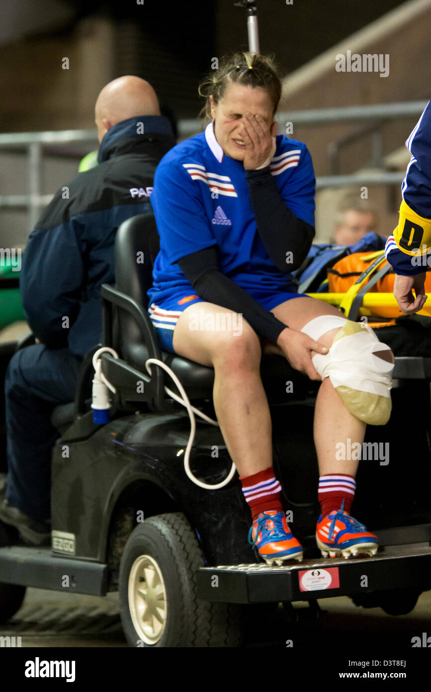 Elodie Poublan (Fra) carried injured from the pitch. England v France