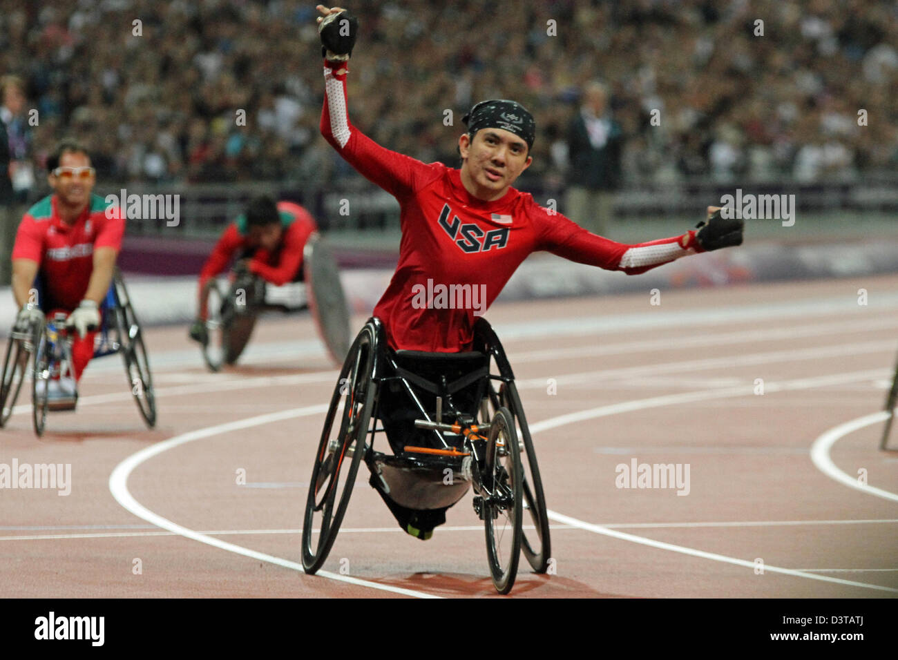 Raymond Martin of USA celebrates after winning gold in the Men's 200m - T52 wheelchair race at the London 2012 Paralympic games Stock Photo