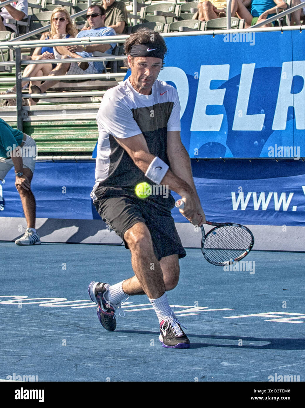 Delray Beach, Florida, U.S. 24th Feb, 2013.  Carlos Moya became the first two-time ATP Champions Tour winner at the Delray Beach ITC when he defeated Hall of Famer John McEnroe 6-4, 6-2 Sunday in the final of the three day tournament. The International Tennis Championships is an ATP World Tour 250 series men's tennis tournament held every year in Delray Beach, Florida. Nike sponsored athlete Carlos Moya. (Credit Image: Credit:  Arnold Drapkin/ZUMAPRESS.com/Alamy Live News/Alamy Live News) Stock Photo