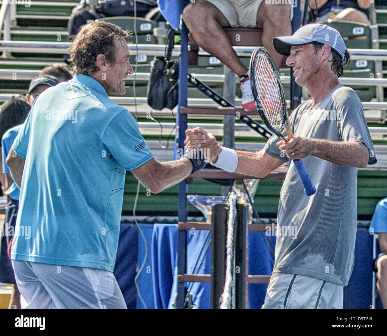 Delray Beach, Florida, USA. 24th February 2013.  Mats Wilander (SWE) at left clasps hands with Aaron Krickstein (USA] after their Champions Tour semifinal match. Krickstein defeated Wilander 4-6, 7-5 (10-5) to take home the third-place trophy. Krickstein, who runs a tennis academy in nearby Boca Raton, won two of his three matches during the three-day event and improved his record to 7-6 at the Delray Beach ITC. The International Tennis Championships is an ATP World Tour 250 series men's tennis tournament held every year in Delray Beach, Florida. (Credit Image: © Arnold Drapkin/ZUMAPRESS.com/A Stock Photo