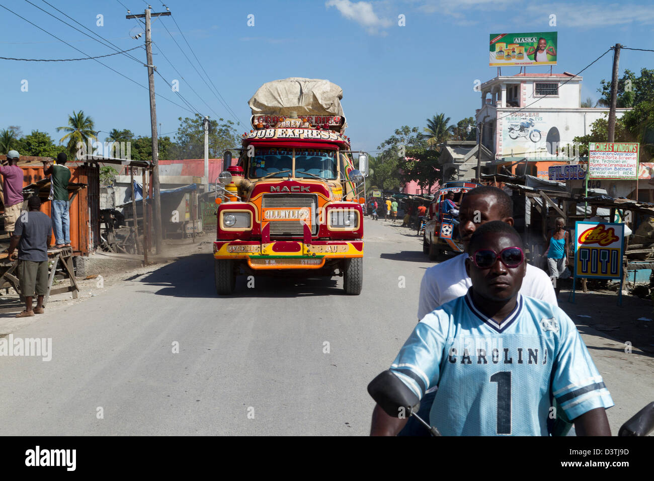 Taptap buses passing through the downtown of PortauPrince. Taptap