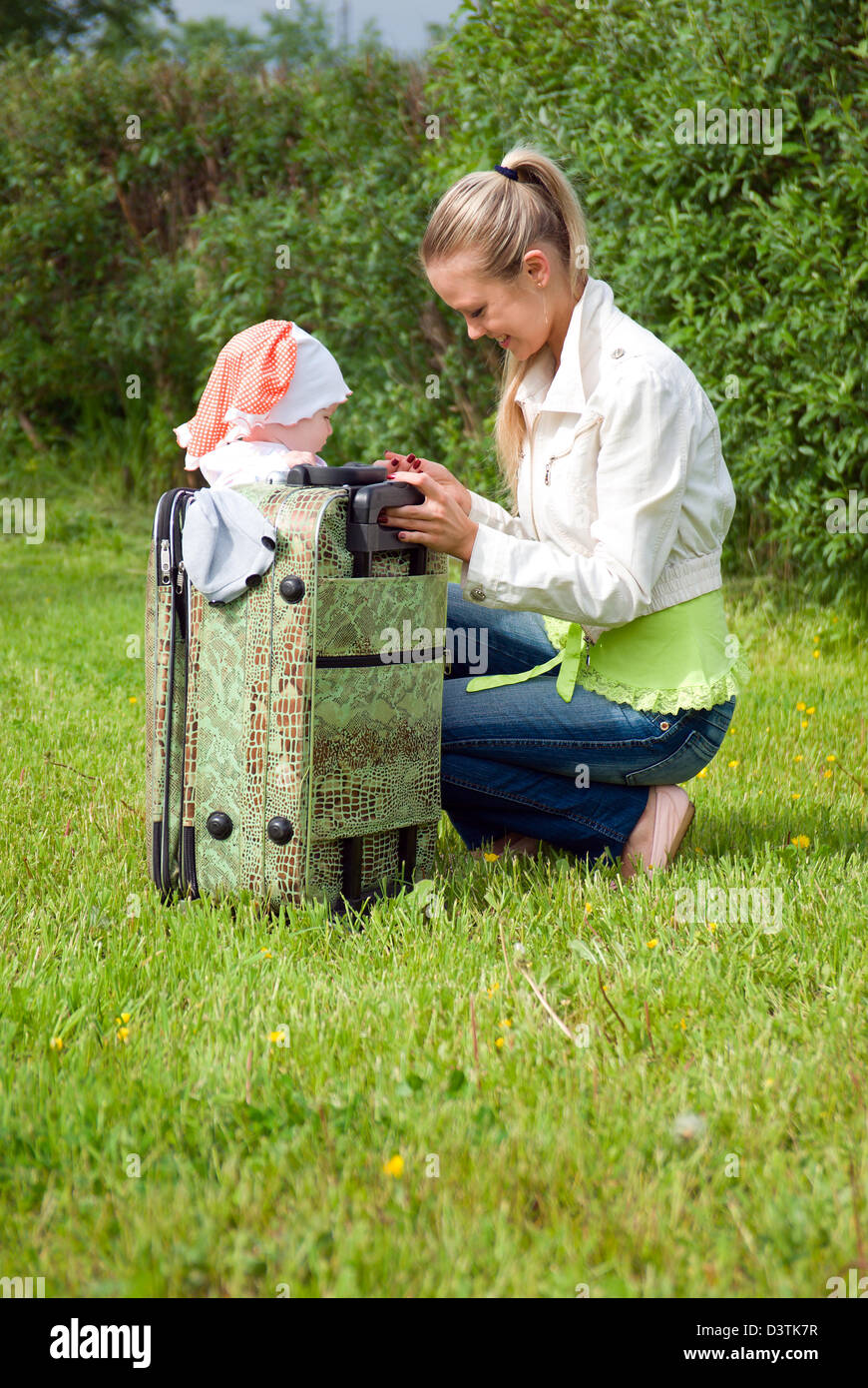 girl and child in valise.family goes to journey Stock Photo