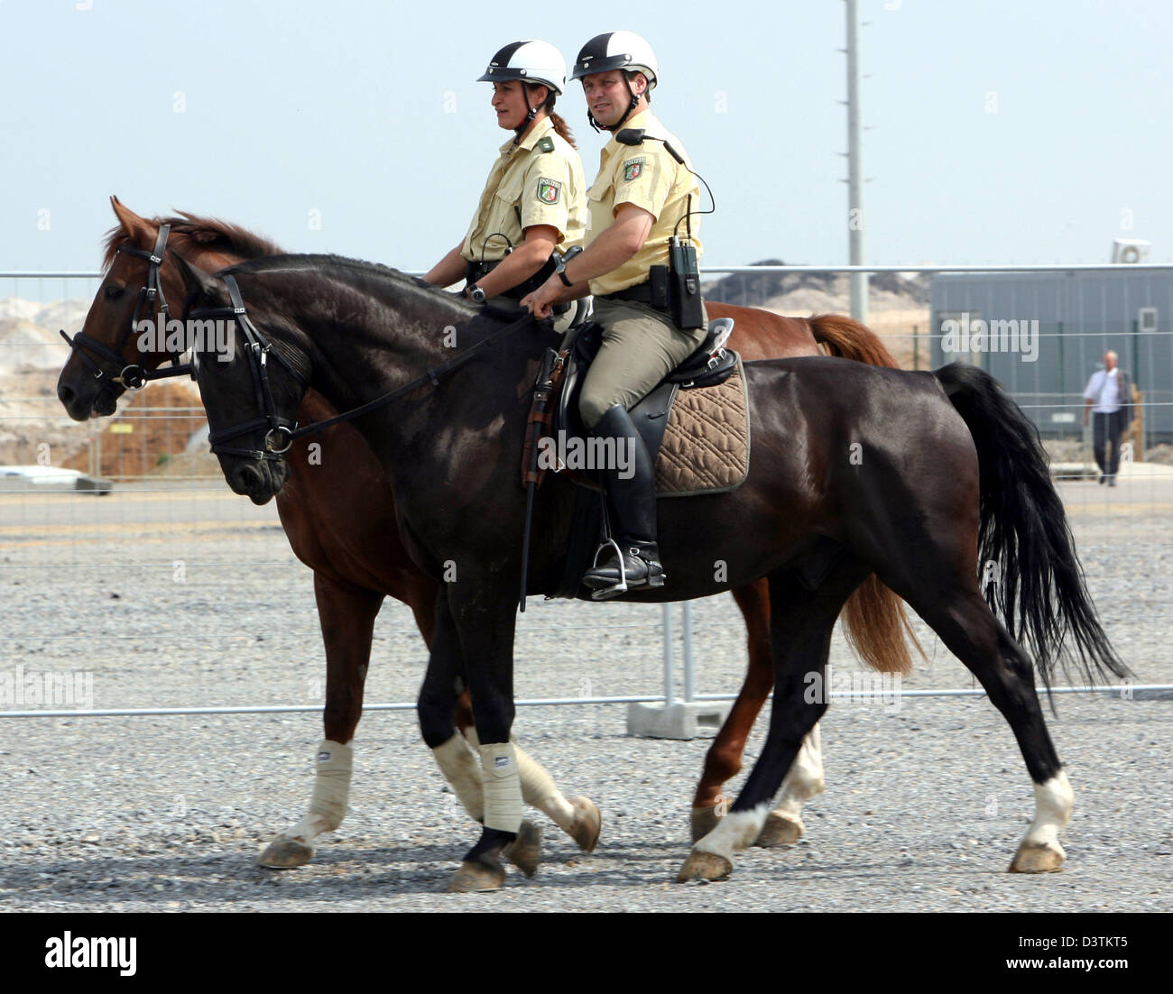 Mounted police officers pictured on the beat in Grevenbroich, Germany, 23 August 2006. The mounted police was axed in 2002 and reinstalled in 2006. Photo: Franz-Peter Tschauner Stock Photo