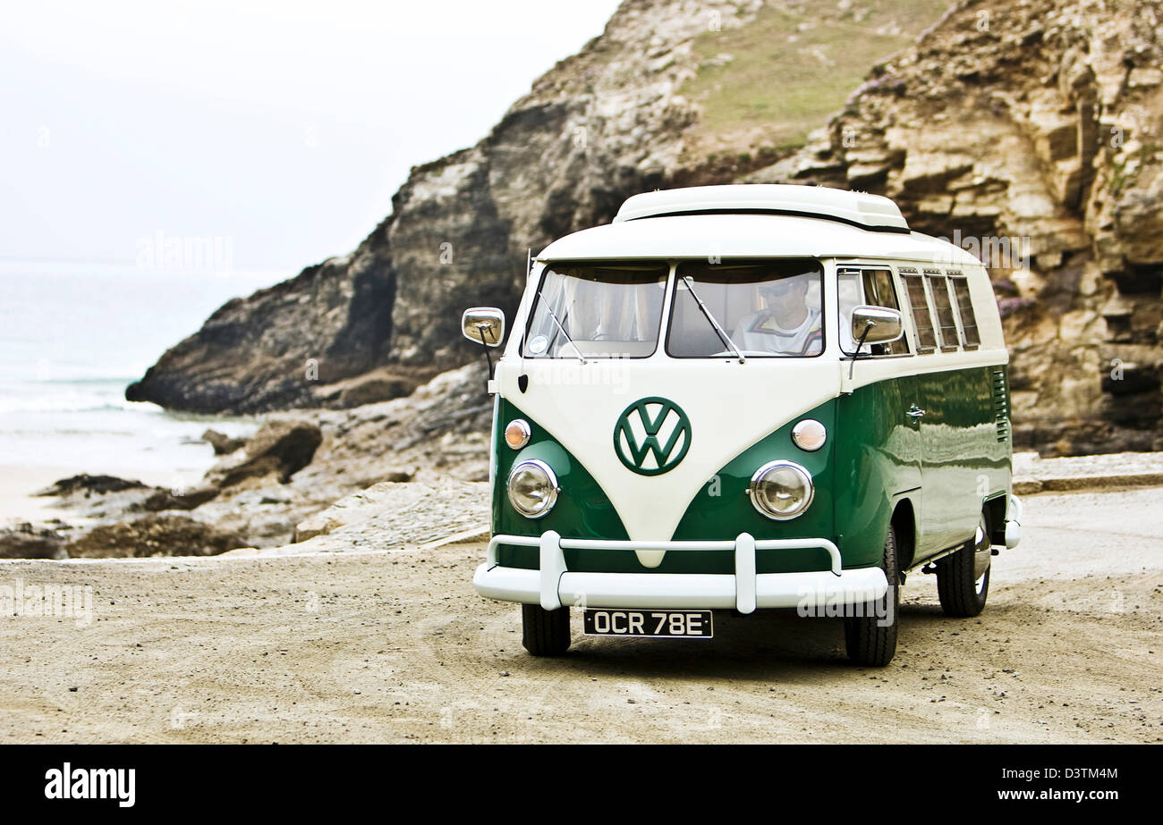 Green VW campervan on beach, St Agnes, Cornwall, UK Stock Photo