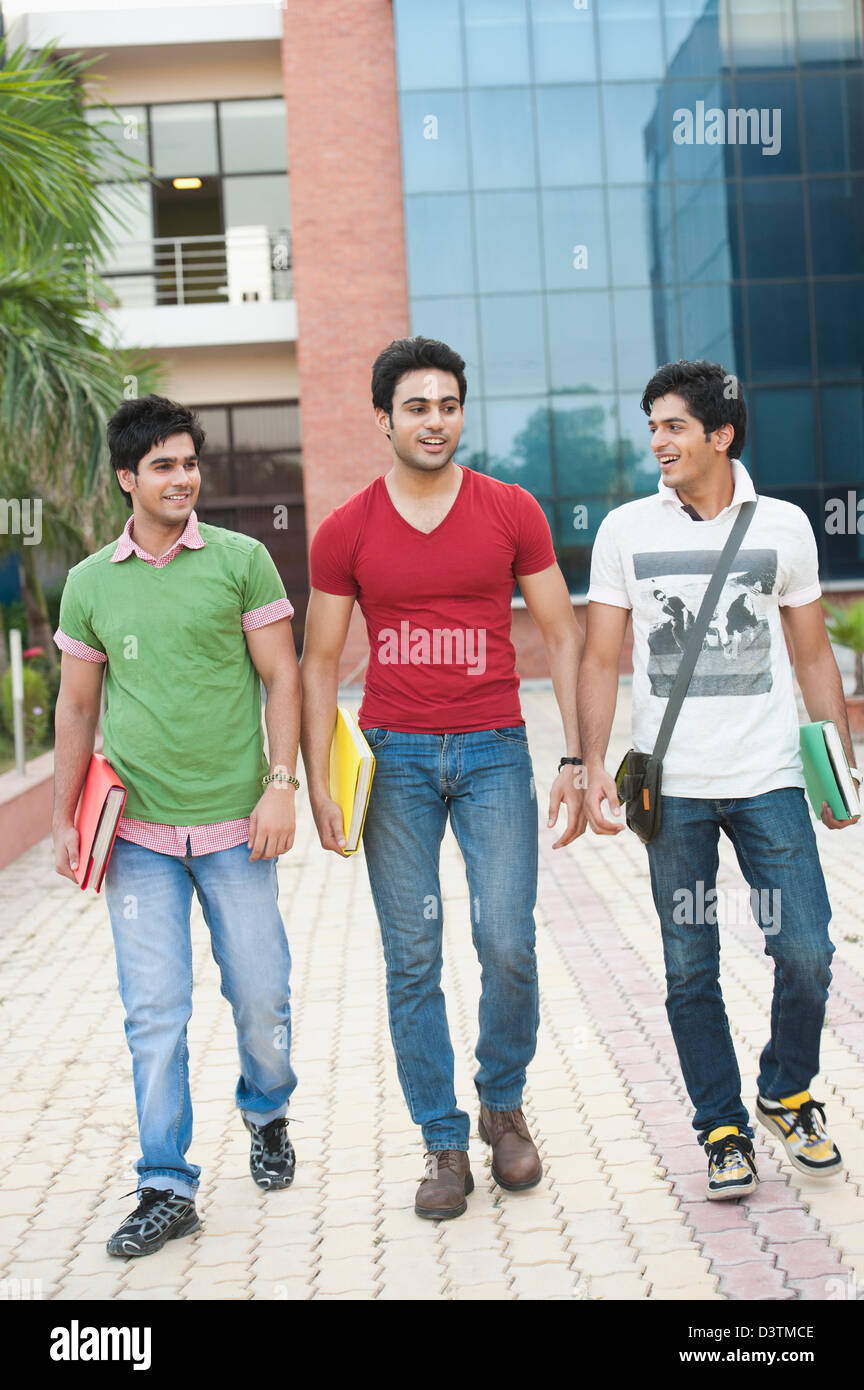 University students walking in university campus Stock Photo - Alamy