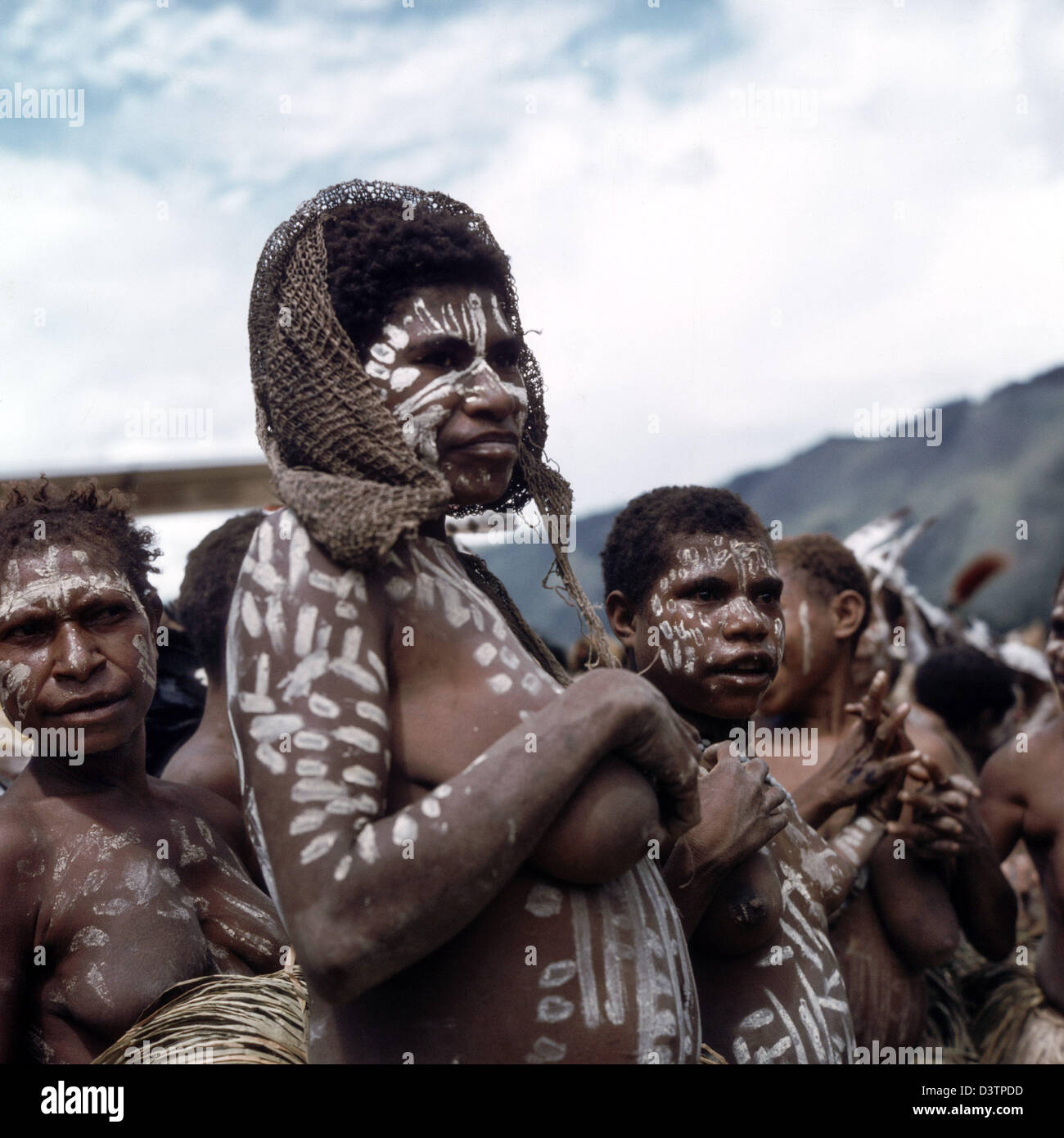 The undated picture shows a group of young Papua women with white body paint  in Papua New Guinea. The population of Papua New Guinea, consisting mainly  of Papuas, is very diverse. The