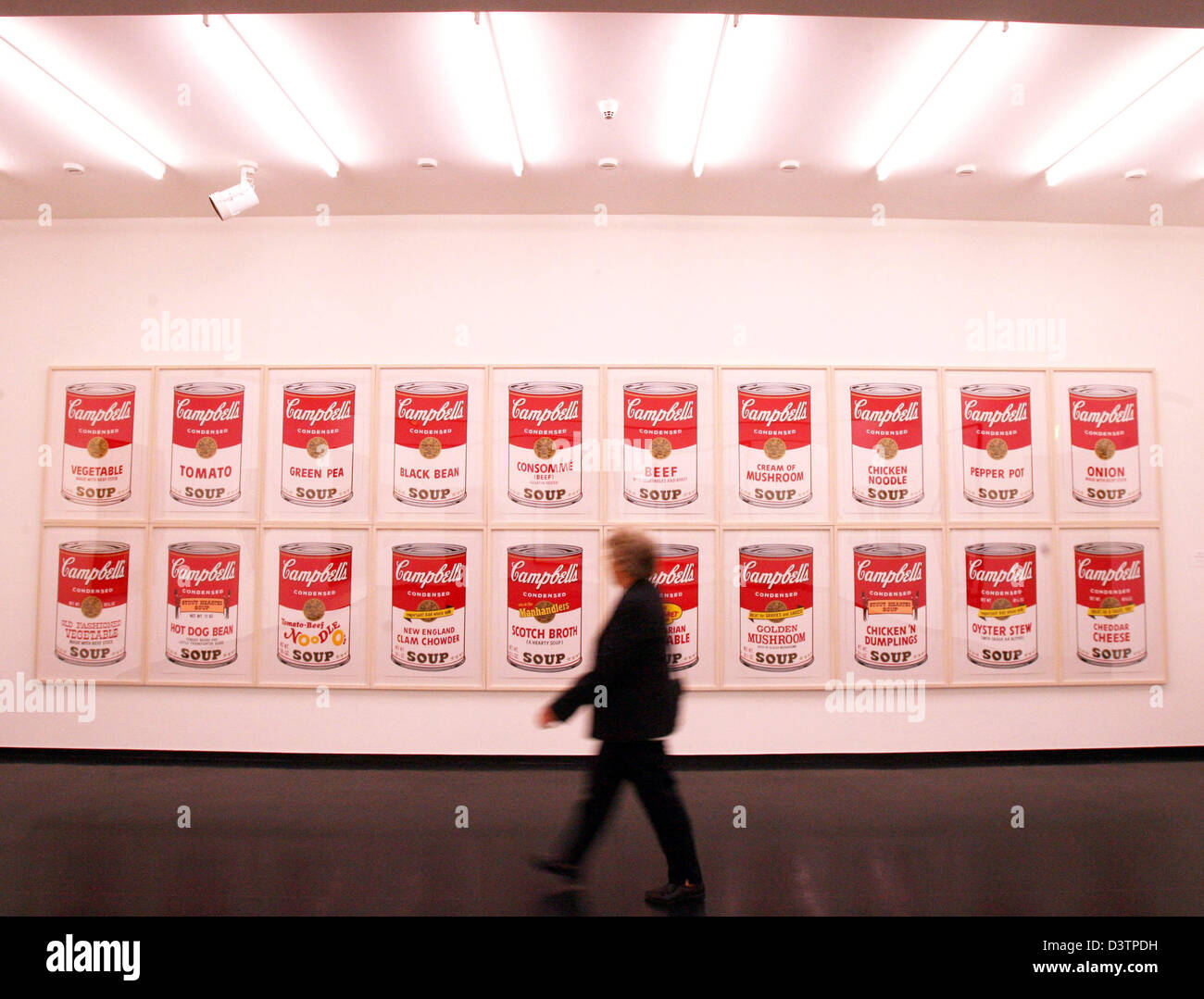 A visitor looks at the portfolios 'Campbells Soup I + II' by Andy Warhol at the 'Hamburger Kunsthalle', Hamburg, Germany, Monday, 30 October 2006. The 'Stiftung fuer Hamburger Kunstsammlungen' has bought these pieces of art for Hamburg's museums and celebrates its 50th anniversary with an exhibition at the 'Museum fuer Kunst und Gewerbe' lasting until 1st January 2007. Photo: Mauri Stock Photo