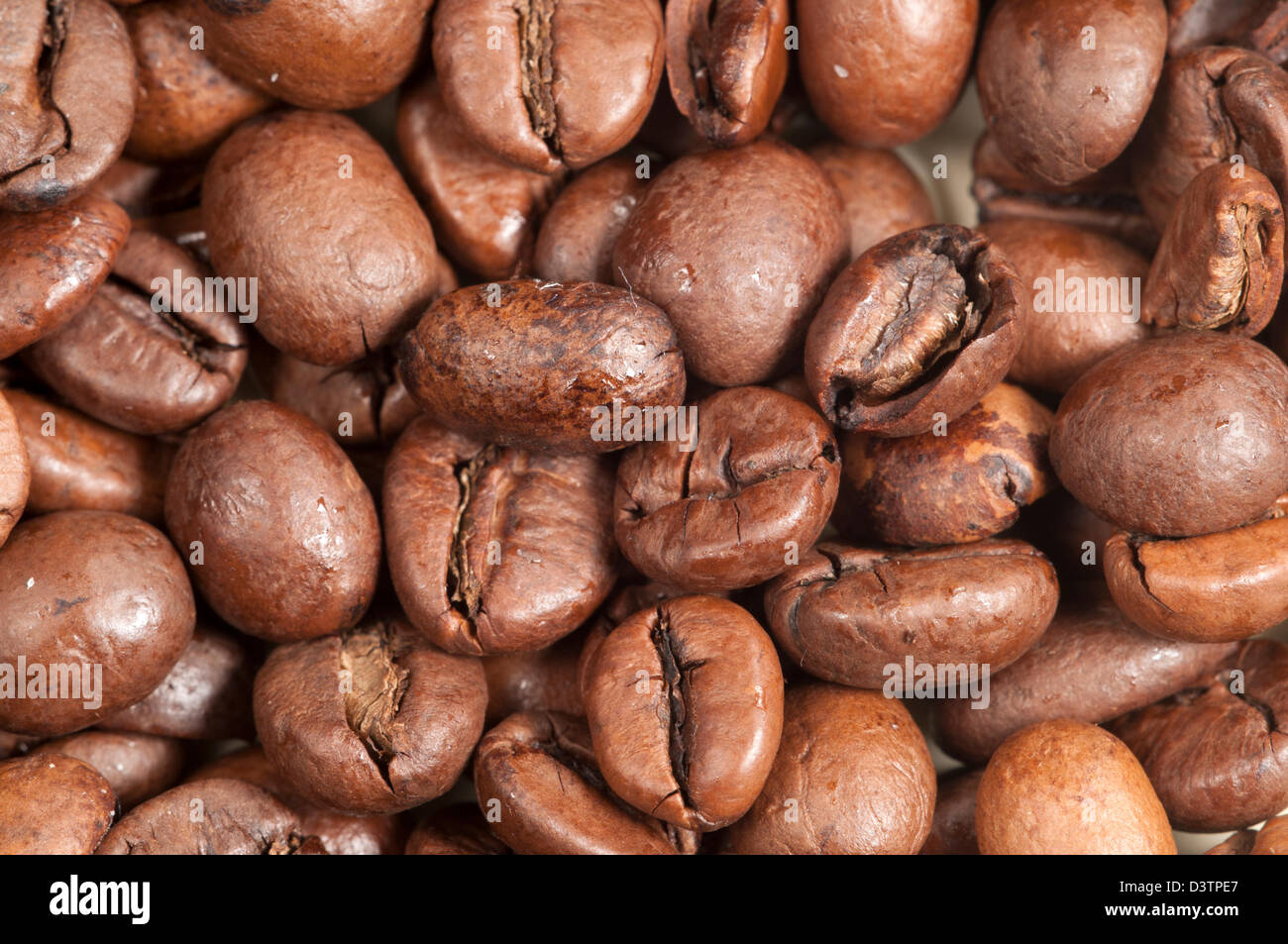 Coffee beans as a background, macro shot Stock Photo - Alamy
