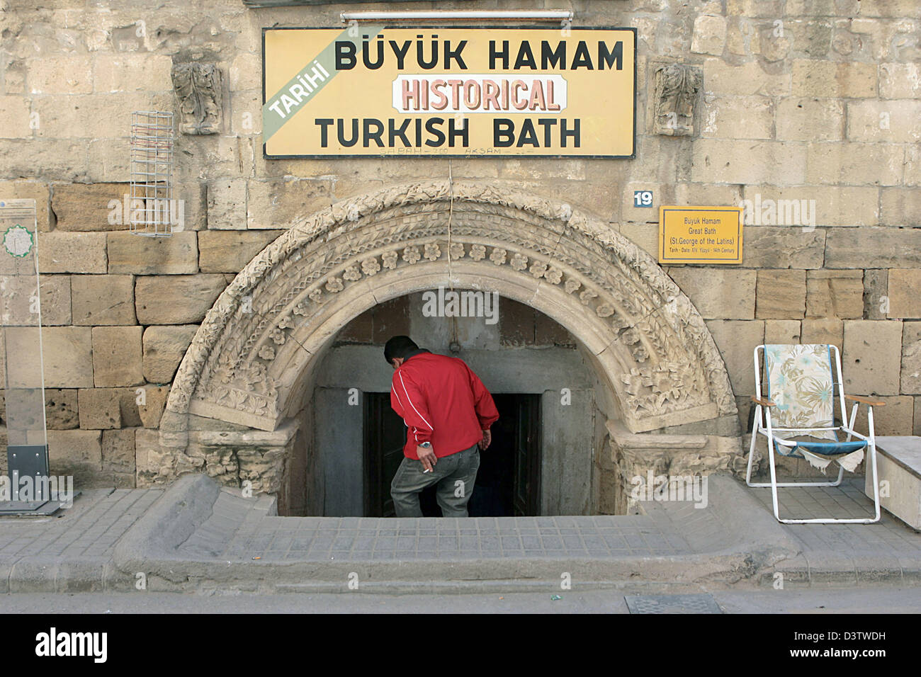 A man enters the historical Bueyuek turkish bath in the Turkish part of