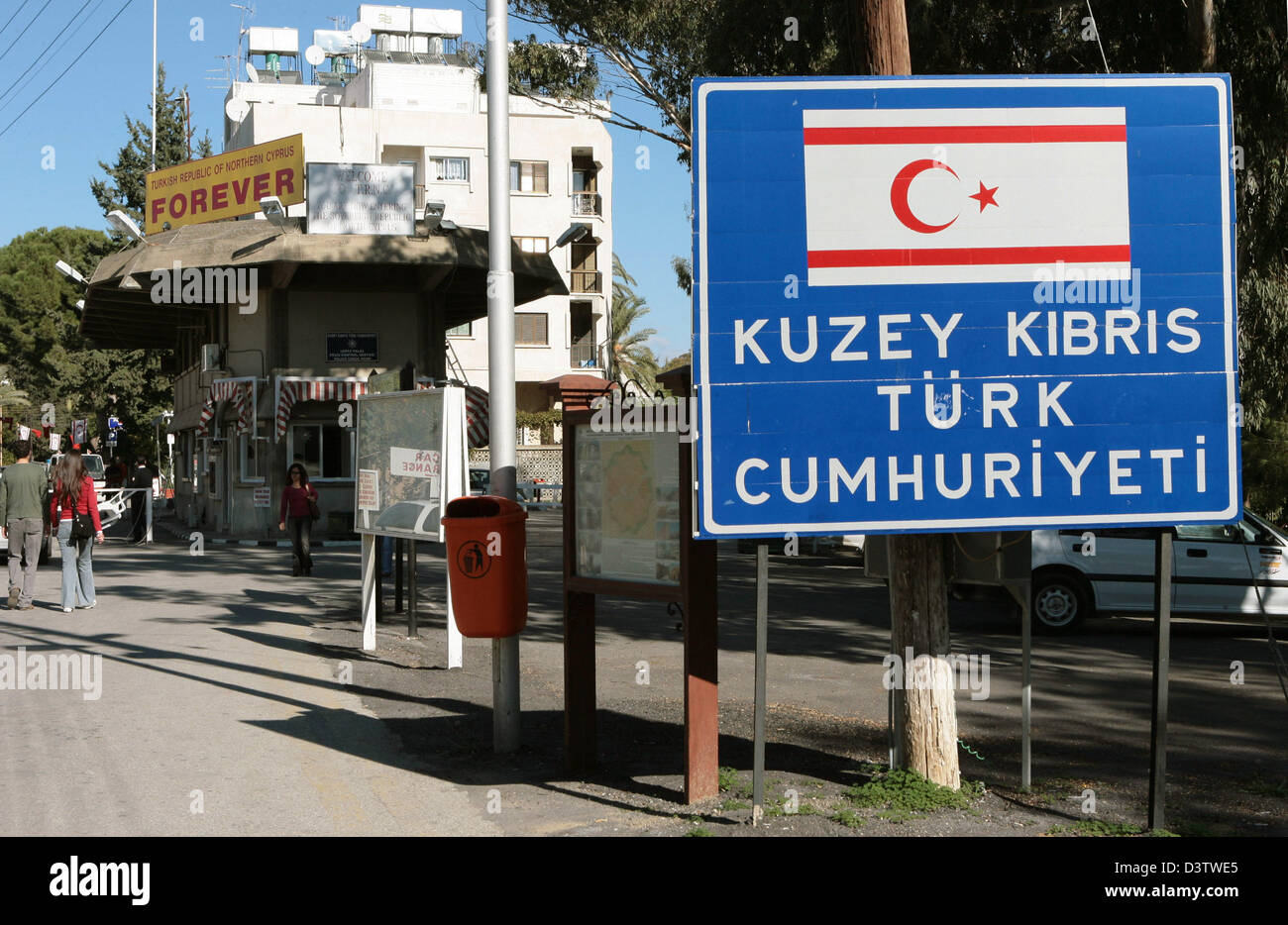 A sign with the CypriotTurkish flag pictured at the border crossing