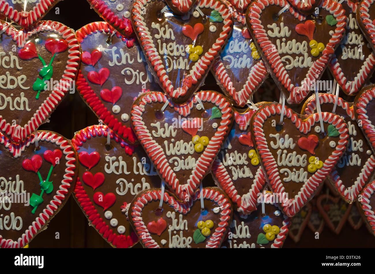Ginger bread hearts for sale at Christmas market with inscription Ïch liebe Dich' (I love you) Stock Photo