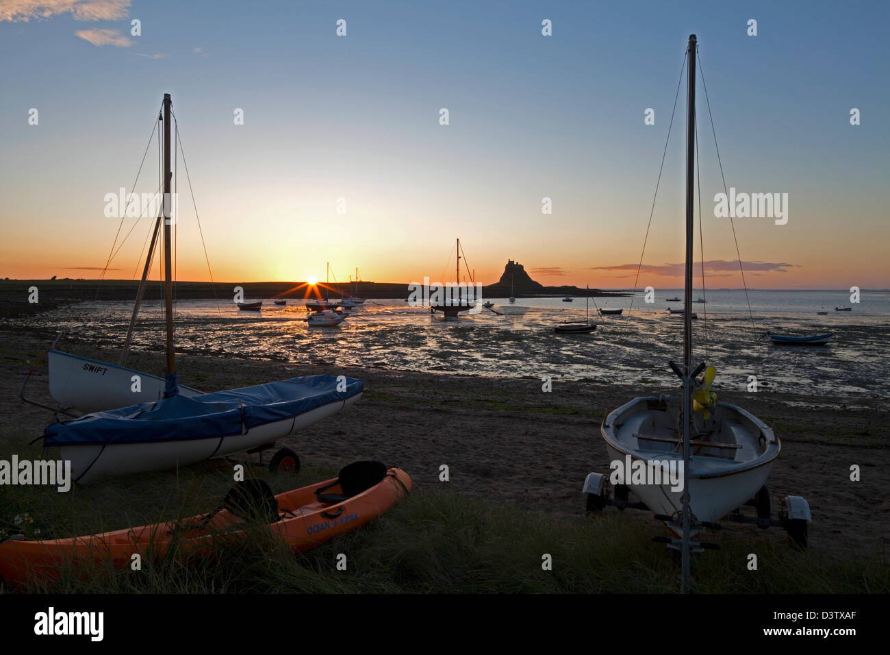 A view of Lindisfarne Castle at dawn on The Holy Island of Lindisfarne in Northumberland Stock Photo