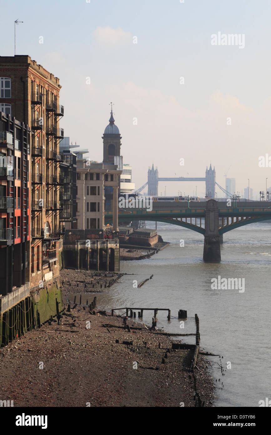 Converted warehouses along the banks of the River Thames London England UK GB Stock Photo