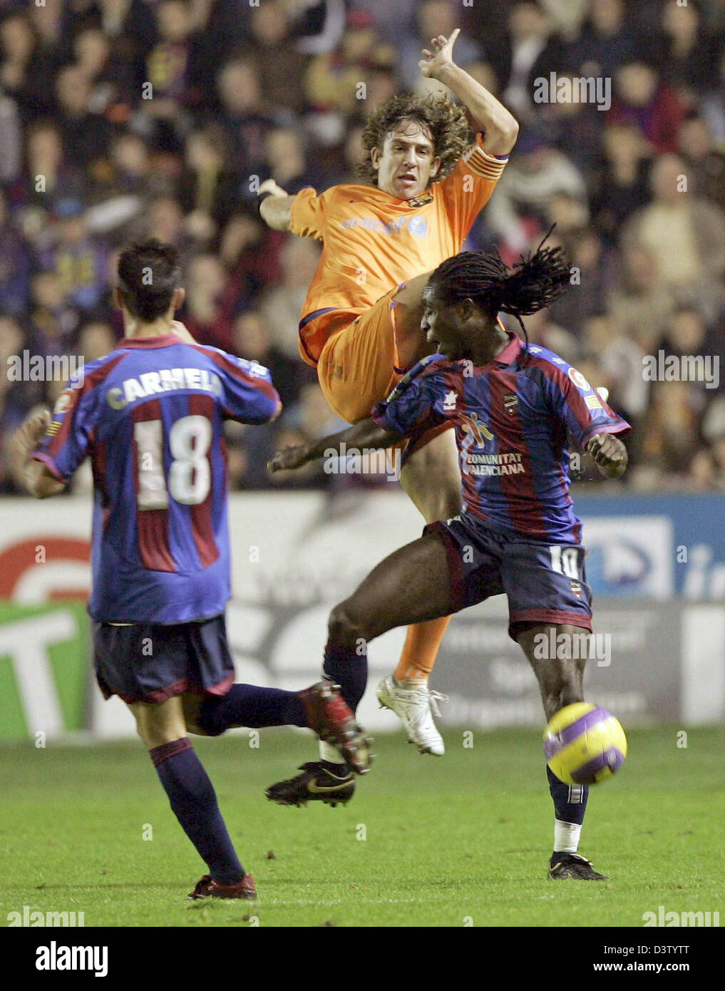 Carles Puyol (top) of Barcelona vies for the ball with Levante's Mustapha Riga and Carmelo Gonzales during the Primera Division match UD Levante vs FC Barcelona at Ciudad de Valencia stadium in Valencia, Spain, Saturday, 02 December 2006. The match ended 1-1. Photo: Juan Carlos Cardenas Stock Photo