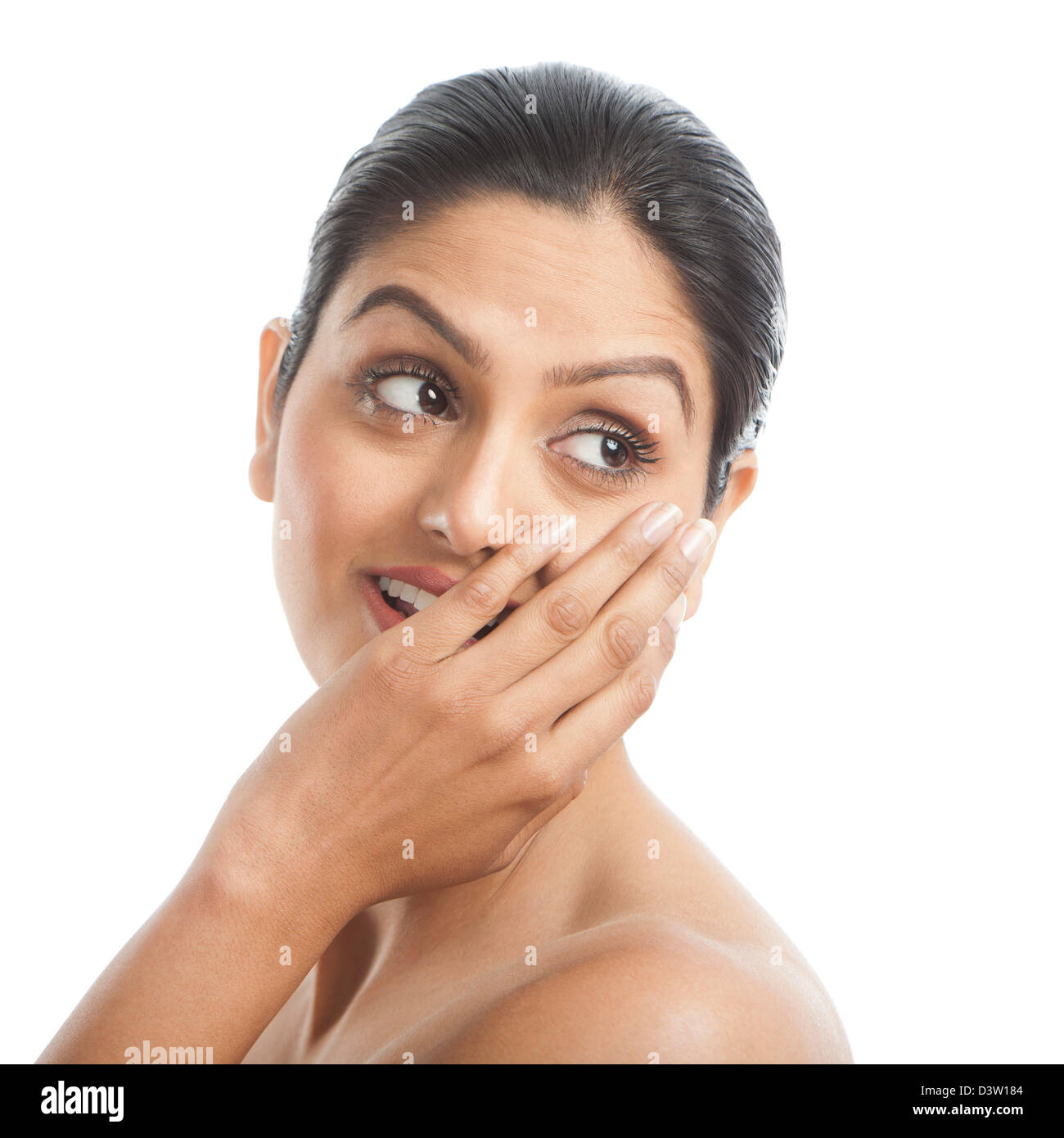 Woman covering her mouth with her hands and smiling Stock Photo - Alamy
